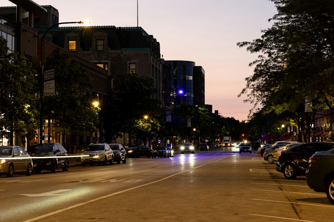 City street at dusk with warm lights